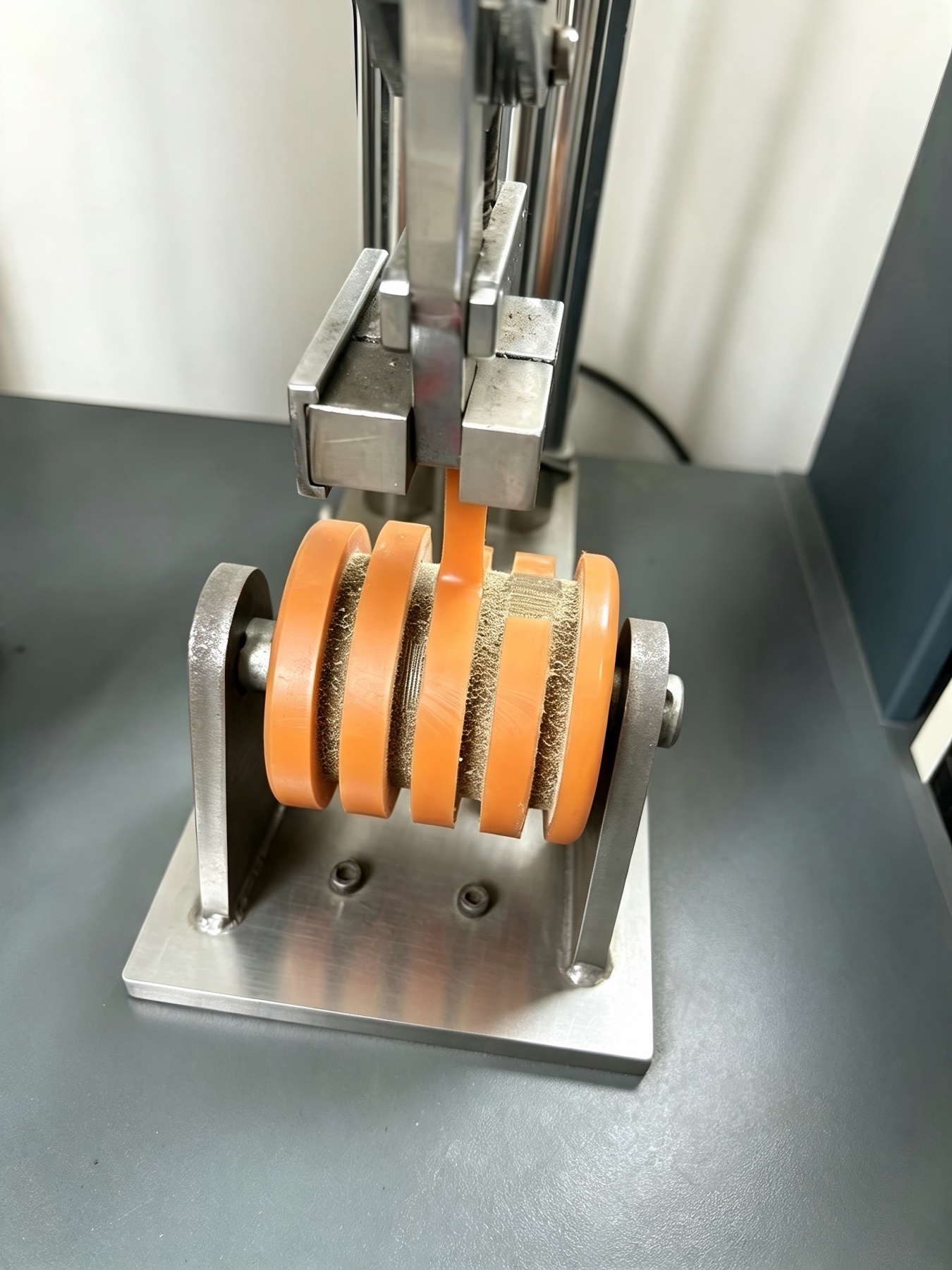 Peel-strength testing of a polyurethane wheel tread sample